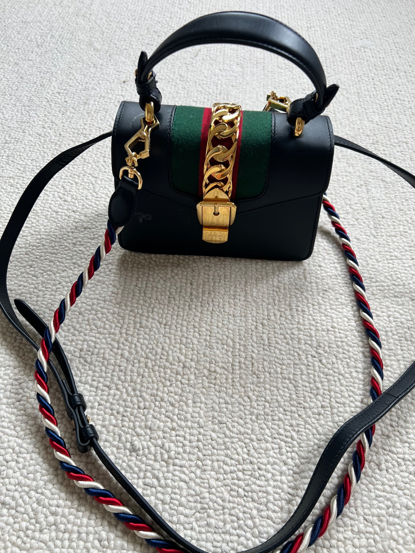 GUCCI 
Calfskin Mini Sylvie Top Handle Bag Black