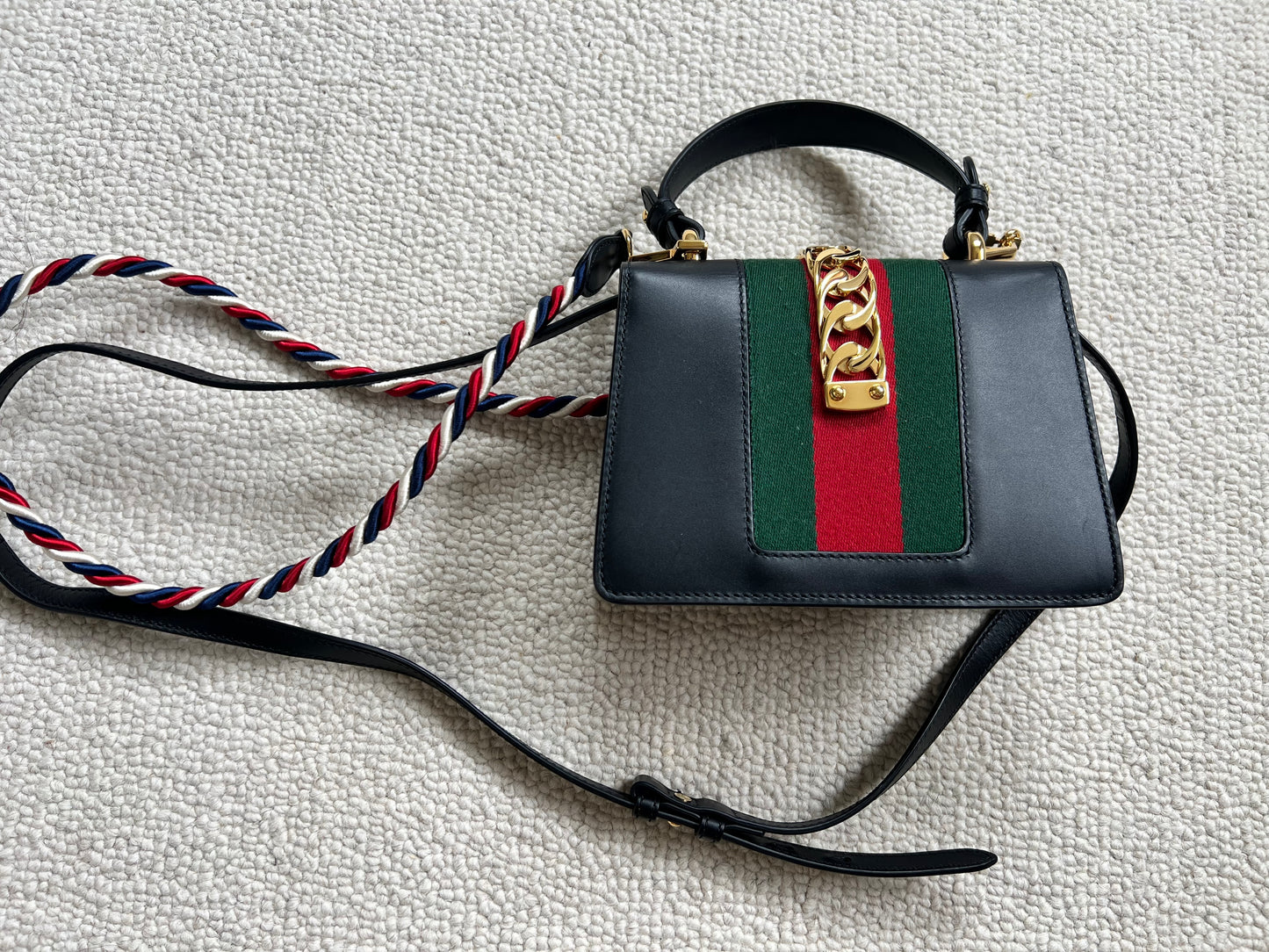 GUCCI 
Calfskin Mini Sylvie Top Handle Bag Black